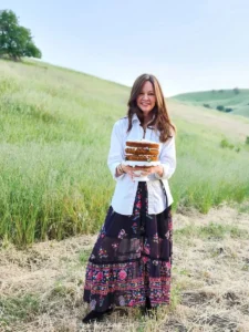 Amy holding a carrot cake