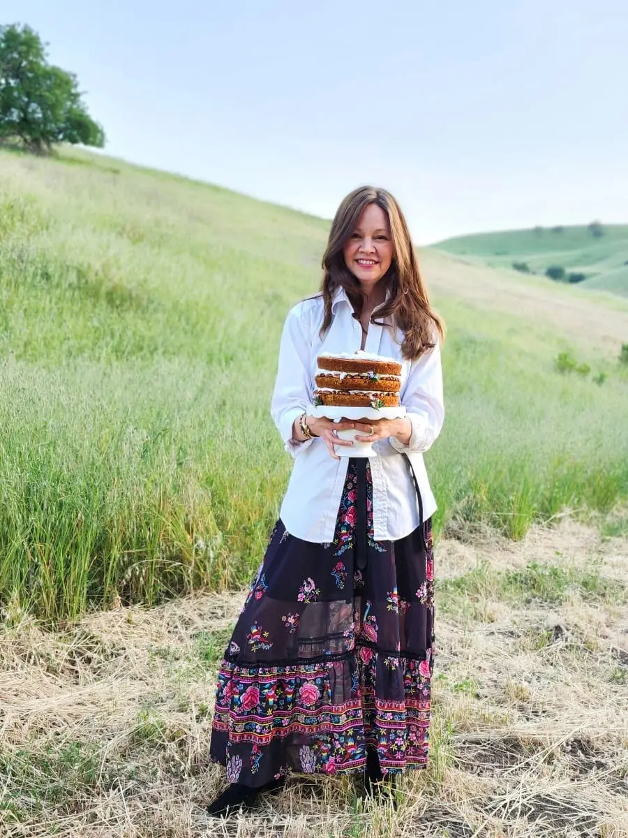 Amy holding a carrot cake