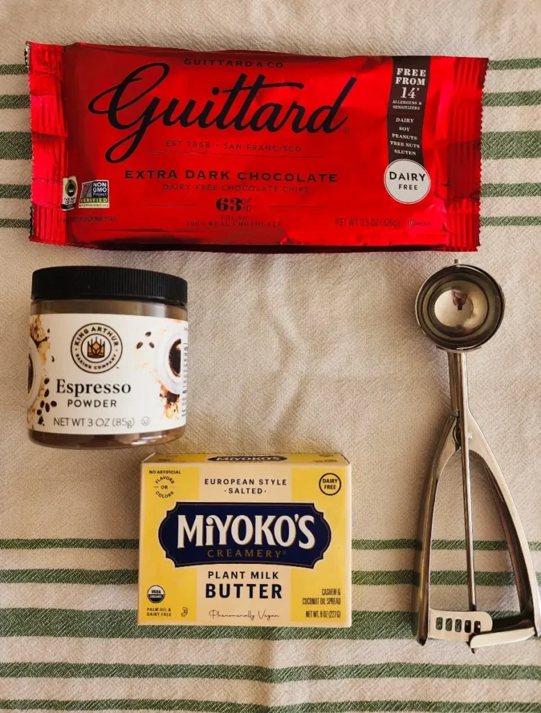 Guittard chocolate chips, espresso powder, Miyoko's butter, and a cookie scoop