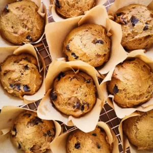 Several pumpkin muffins on a cooling rack