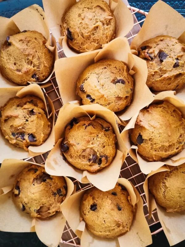 Several pumpkin muffins on a cooling rack