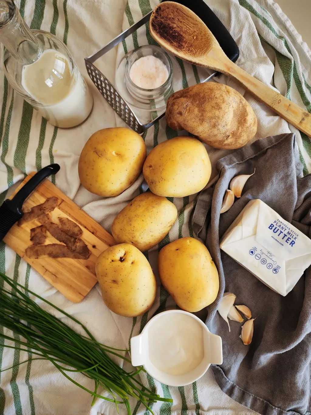 ingredients for dairy free mashed potatoes on a kitchen towel
