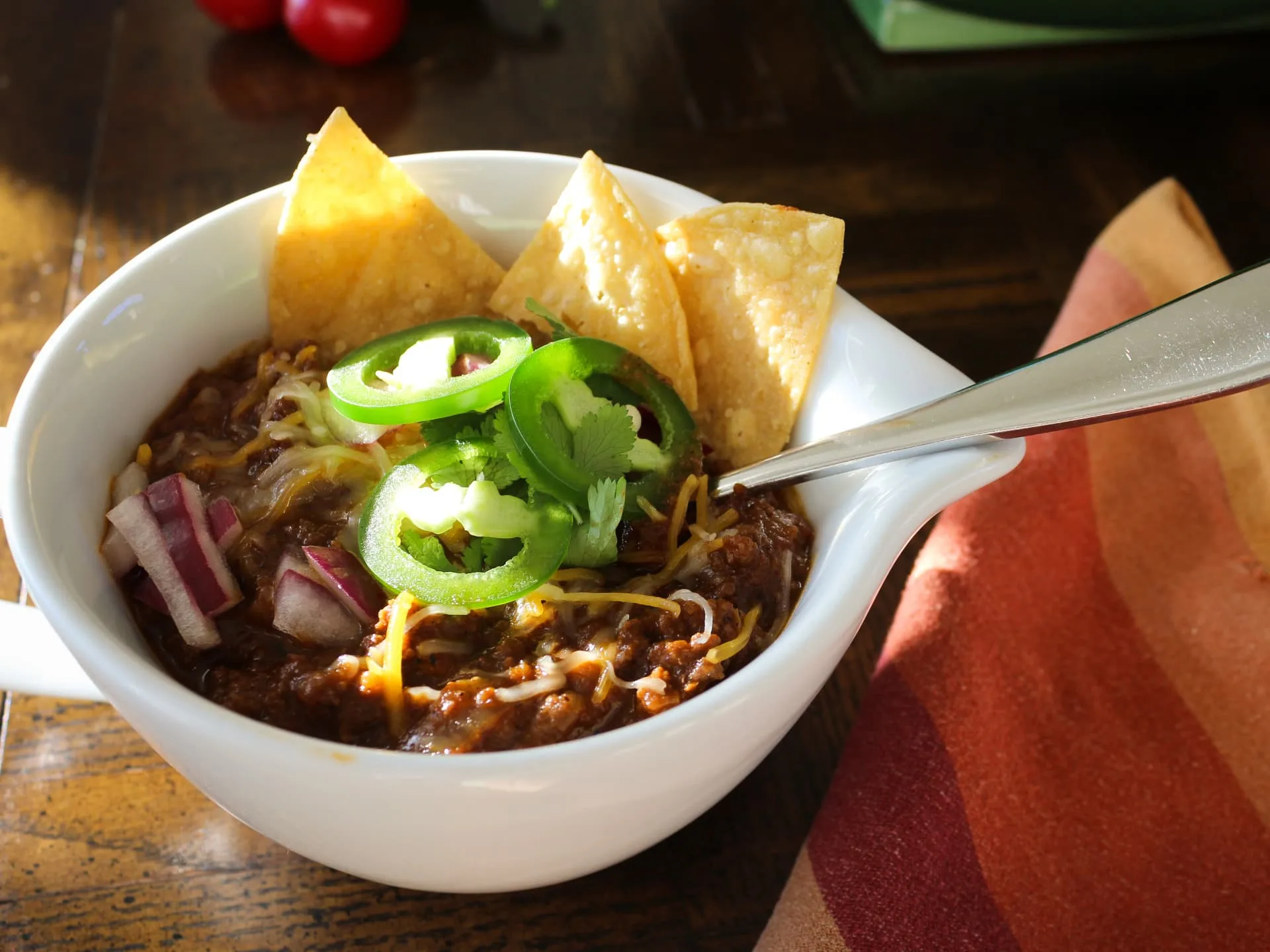 bowl of Texas-style chili with toppings